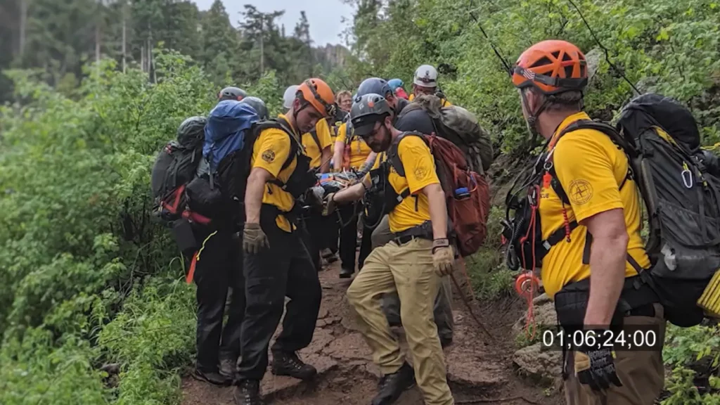 Rock climbers in Colorado are struck by lightning and in need of help, fast! Then, firefighters perform rescues within a flood zone only to find their own station overtaken by the rising water.